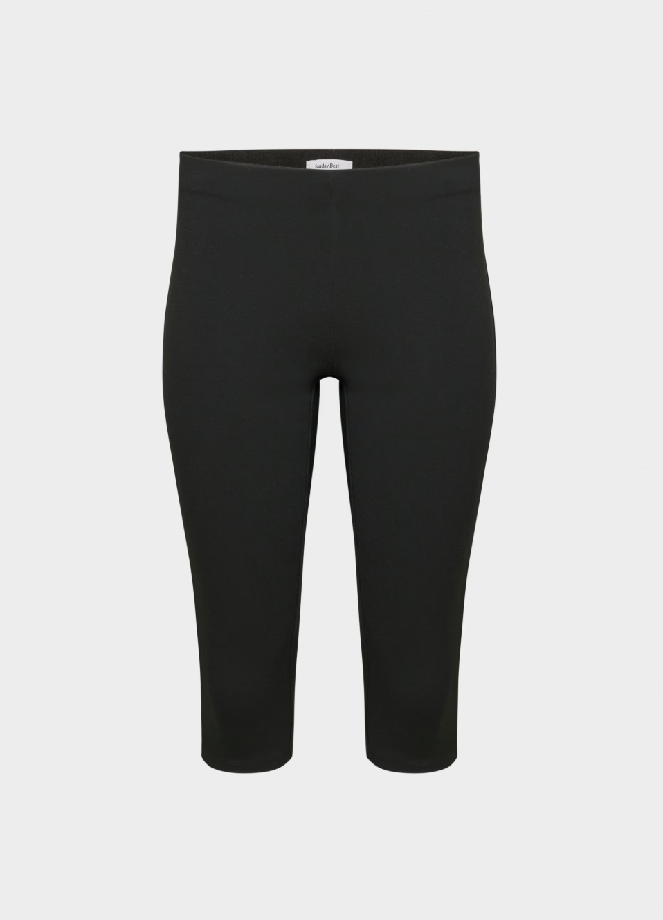a pair of aritzia capris on a plain backdrop