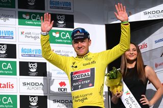 ALTO DO MALHAO PORTUGAL FEBRUARY 18 Remco Evenepoel of Belgium and Team Soudal Quick Step Yellow leader jersey celebrates at podium as final overall race winner during the 50th Volta ao Algarve em Bicicleta 2024 Stage 5 a 1658km stage from Faro to Alto do Malhao 514m on February 18 2024 in Alto do Malhao Portugal Photo by Dario BelingheriGetty Images