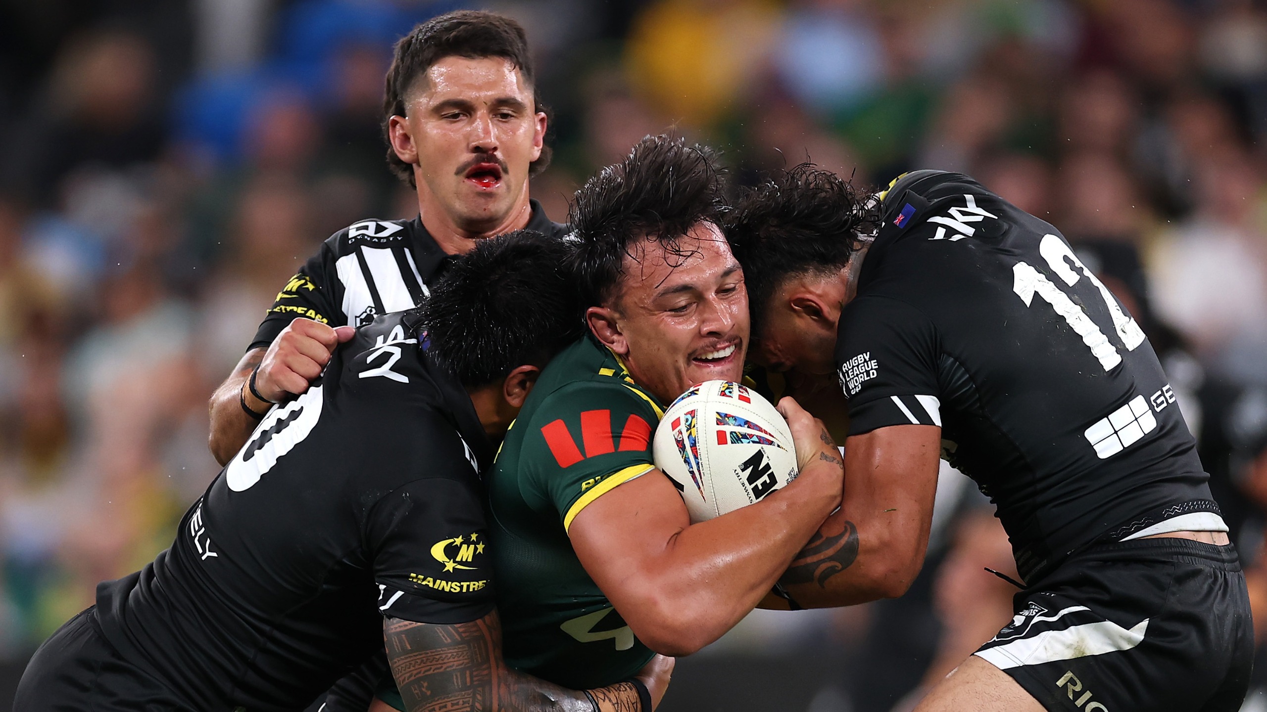Tino Fa'asuamaleaui of Australia is tackled during the 2026 Men's Rugby League World Cup match between Australia Kangaroos and New Zealand Kiwis at Allianz Stadium on October 15, 2026 in Sydney, Australia.