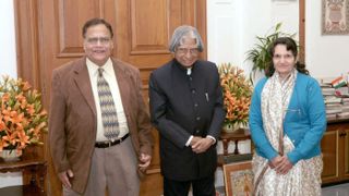 A.P.J. Abdul Kalam (center), an aerospace scientist who served as the president of India from 2002 to 2007, poses for a photo with Dr. Ravi Sharma (left) and his wife.
