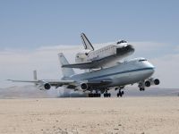 NASA's Shuttle Carrier Aircraft with the space shuttle Endeavour securely mounted on top touches down at Edwards Air Force Base after third leg of its four-segment final ferry flight from the Kennedy Space Center in Florida to Los Angeles International Airport on Sept. 20, 2012. 