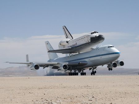 NASA's Shuttle Carrier Aircraft with the space shuttle Endeavour securely mounted on top touches down at Edwards Air Force Base after third leg of its four-segment final ferry flight from the Kennedy Space Center in Florida to Los Angeles International Airport on Sept. 20, 2012. 