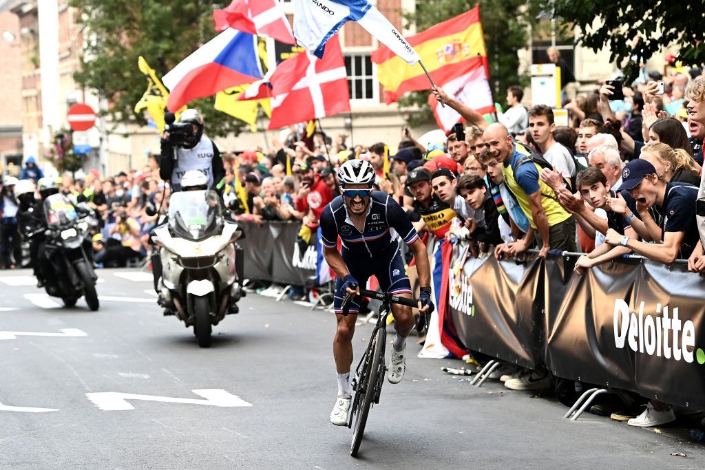 LEUVEN BELGIUM SEPTEMBER 26 Julian Alaphilippe of France attacks in the breakaway while fans cheer during the 94th UCI Road World Championships 2021 Men Elite Road Race a 2683km race from Antwerp to Leuven flanders2021 on September 26 2021 in Leuven Belgium Photo by Alex Broadway PoolGetty Images