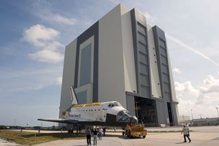 At NASA’s Kennedy Space Center in Florida, space shuttle Atlantis is towed from the Vehicle Assembly Building (VAB) before being put on display at the Kennedy Space Center Visitor Complex.