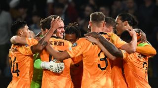 Netherlands players celebrate victory over Greece in a Euro 2024 qualifier in October 2023.