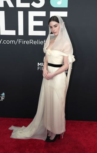 Gracie Abrams wearing Chanel gown and Chanel jewels on 2025 Grammys Red Carpet