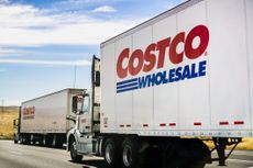 Costco Wholesale trucks driving on the freeway 