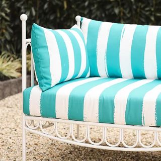 A striped green and white sofa