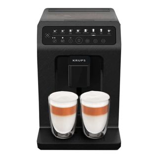 A black countertop coffee machine with two cups of espresso 