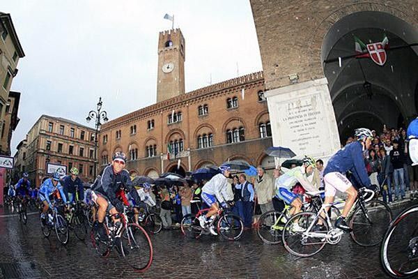 Di Luca and co. are wrapped up against the bad weather