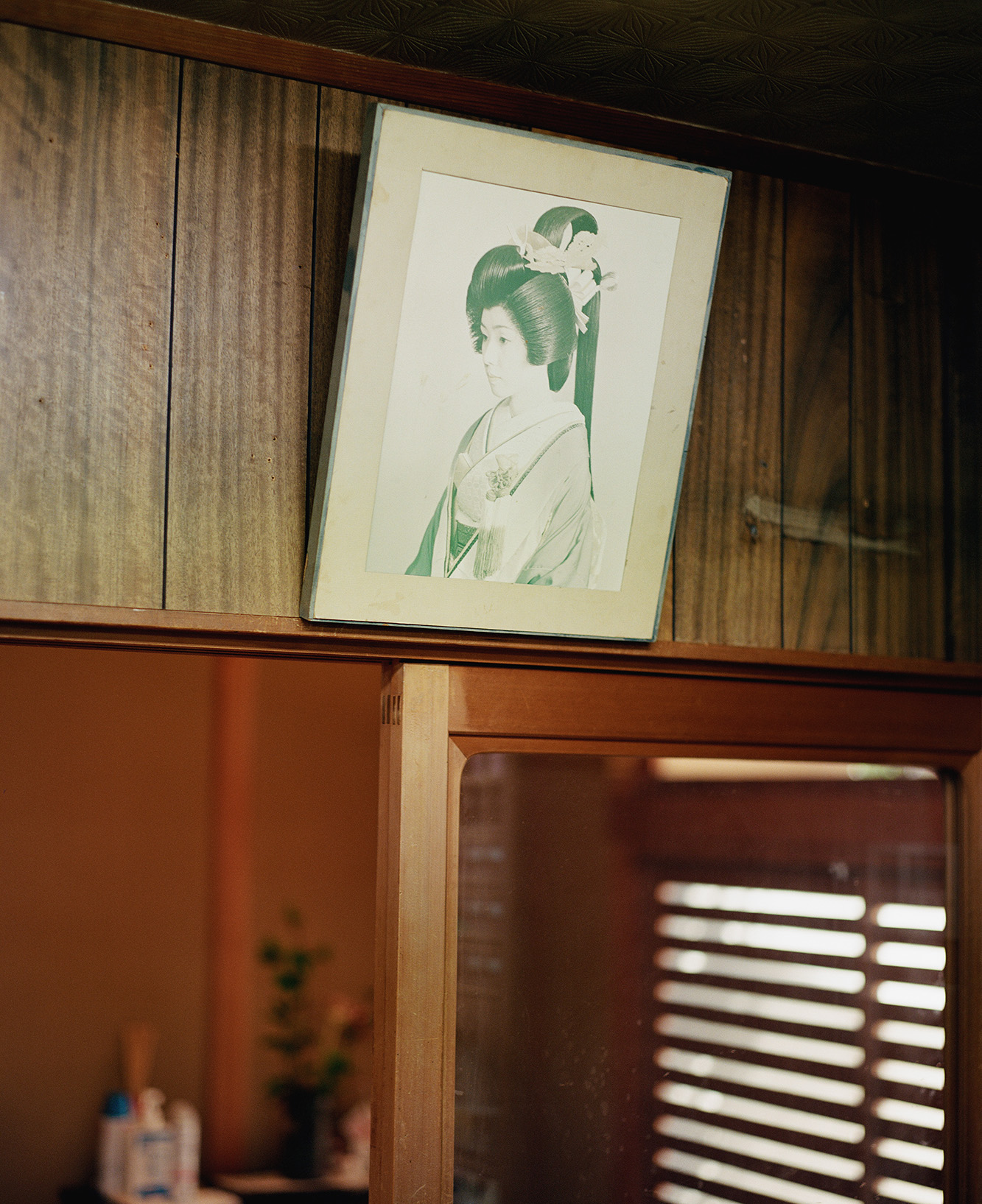 picture on wall of wig maker in Kyoto