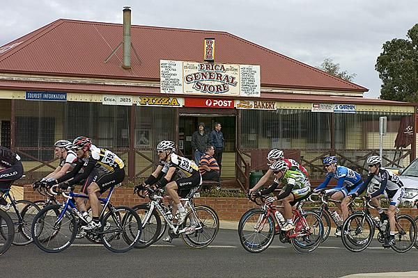The peloton pass the General Store at Erica in the final 20 kilometres of the stage.