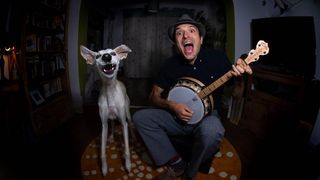 dog and man with banjo