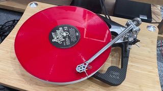 Rega Naia with red vinyl playing