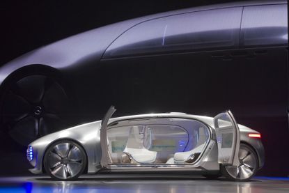 The Mercedes-Benz F015 Luxury in Motion autonomous concept car is shown on stage during the 2015 International Consumer Electronics Show.