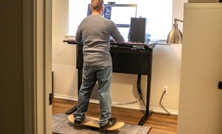 Working at a standing desk while using a WhirlyBoard