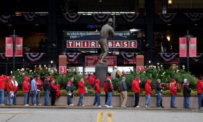 Fans wait to enter Busch Stadium in St. Louis prior to the World Series opener on Wednesday, which pits the hometown Cardinals against the Texas Rangers.