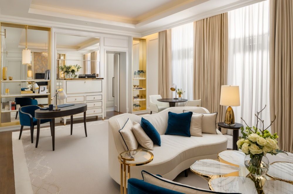 A lush cream and blue hotel room