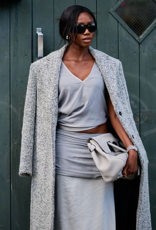 a photo of a woman wearing an italian bag brand