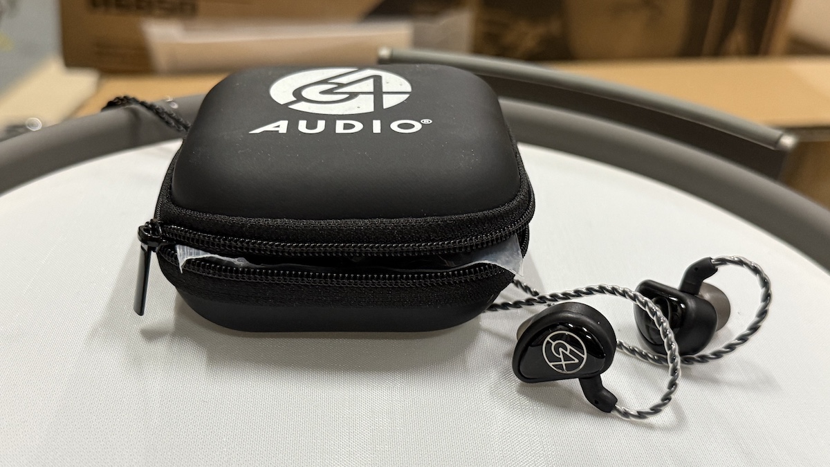64 Audio Aspire 4 in-ears poking out of a black case