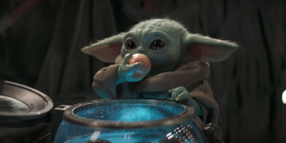 The mandalorian baby yoda eating frog lady egg