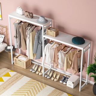 Closet corner system in White, with hanging clothes and shoes on floor