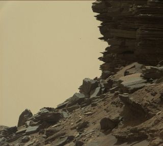 This view of Mars from NASA's Curiosity rover shows a dramatic hillside outcrop with stacks of sandstone layers that scientists refer to as "cross-bedding."