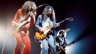 Lynyrd Skynyrd's Allen Collins, Gary Rossington (playing Gibson Les Paul), Steve Gaines performing live onstage