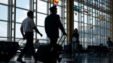 Pilots are seen walking through Ronald Reagan Washington National Airport in Arlington, Virginia.