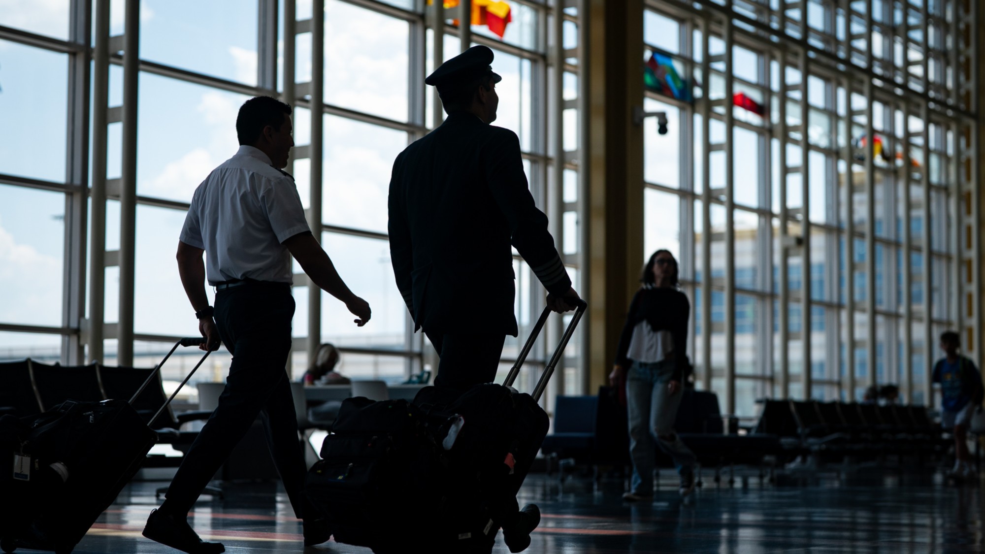Pilots are seen walking through Ronald Reagan Washington National Airport in Arlington, Virginia.