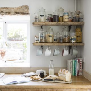 open kitchen shelving with food in glass jars