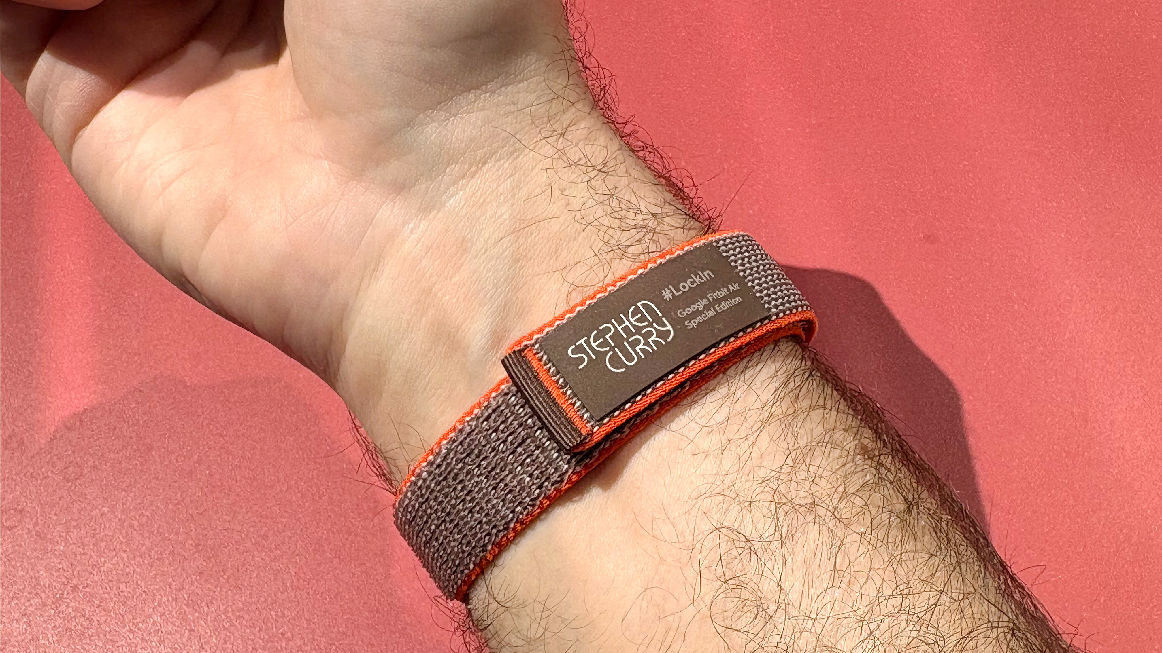 Hands-on with the Fitbit Air on the orange and brown Stephen Curry strap