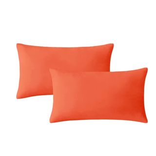 Two orange outdoor cushions