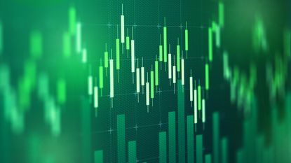 A digital chart displays stock market trends with green bars and lines