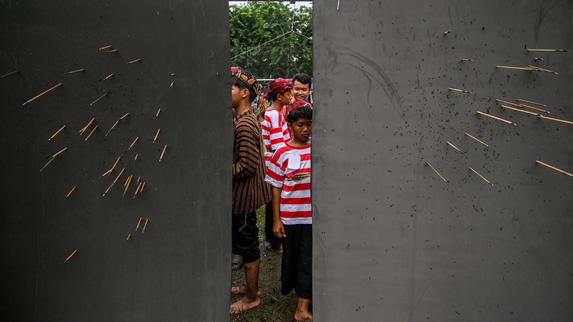 
                                Children look for their arrows during an archery contest in Surabaya, Indonesia 
                            