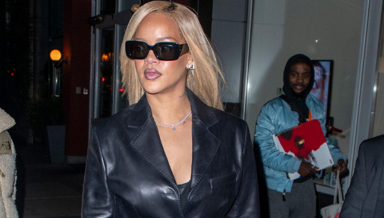 Rihanna in Manhattan with blonde hair square sunglasses and a leather blazer