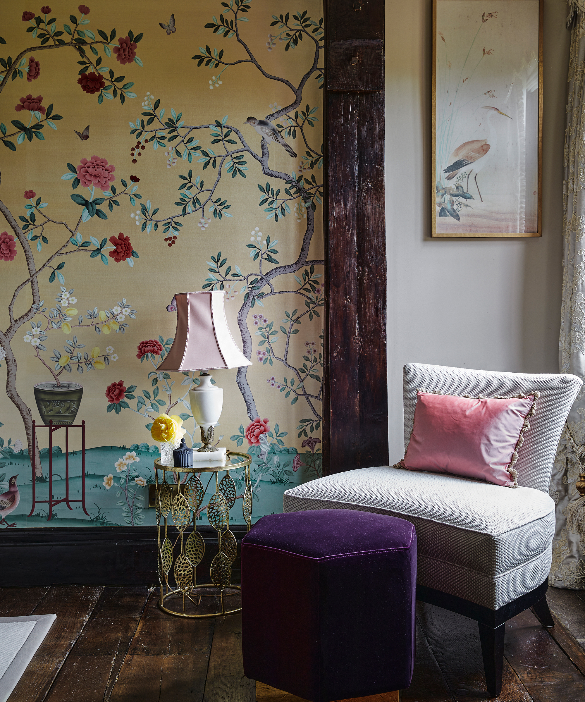 chinoiserie style wallpaper in bedroom with occasional chair
