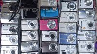Vendors display a vast collection of vintage digital point-and-shoot cameras for sale at street market on April 30, 2026 in Hong Kong, China. (Photo by Sawayasu Tsuji/Getty Images)