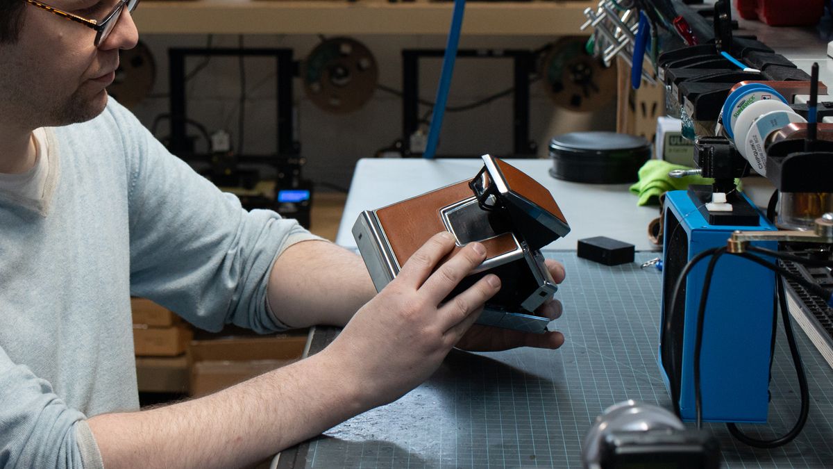 Tear down of the Polaroid SX-70 camera in the Retrospekt workshop during a refurbish