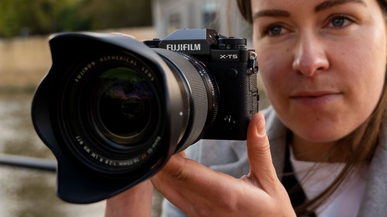 Fujifilm X-T5 in the reviewer's hands