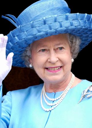 Queen Elizabeth II wearing her signature pearl necklace