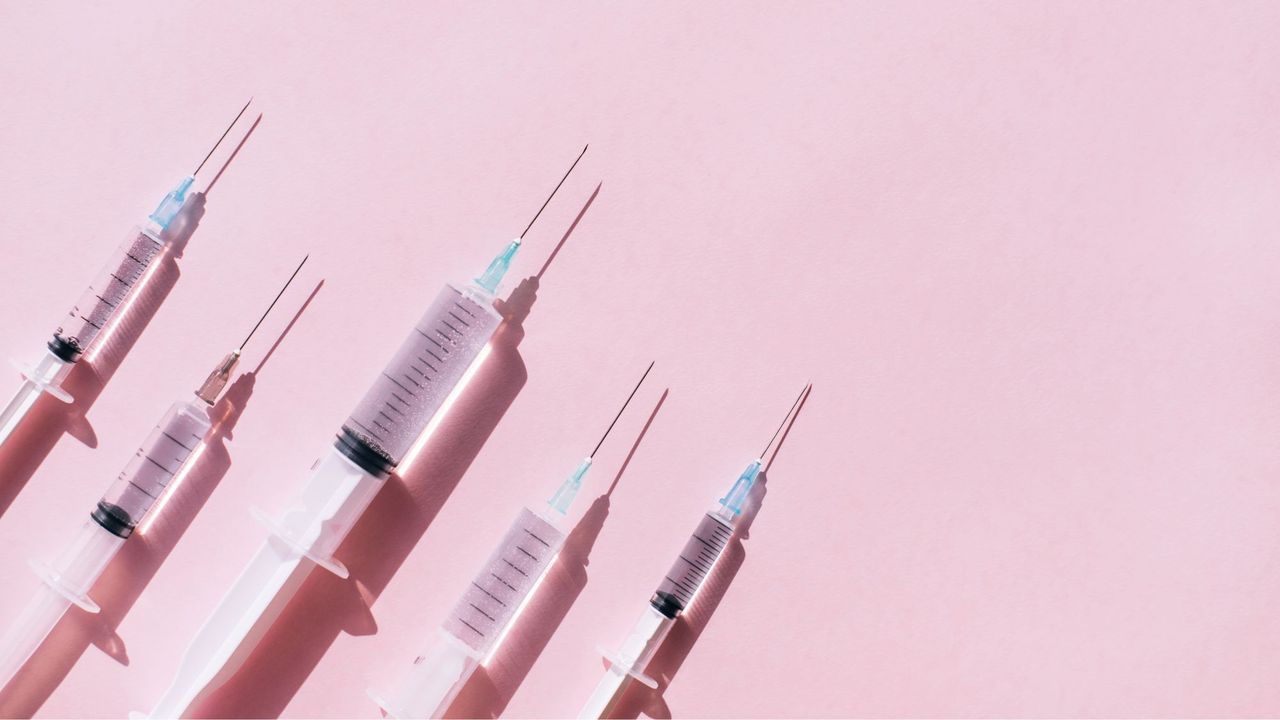 Black market Ozempic: Needles against a pink background