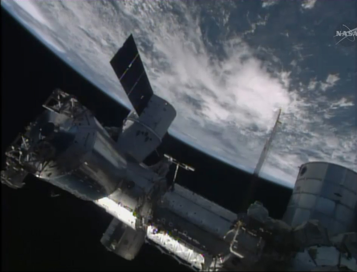 The SpaceX-3 Dragon cargo ship is seen attached to the International Space Station on April 20, 2014 for an Easter Sunday cargo delivery of 2.5 tons of food, supplies and gear for the orbiting lab&#039;s six-person Expedition 39 crew.