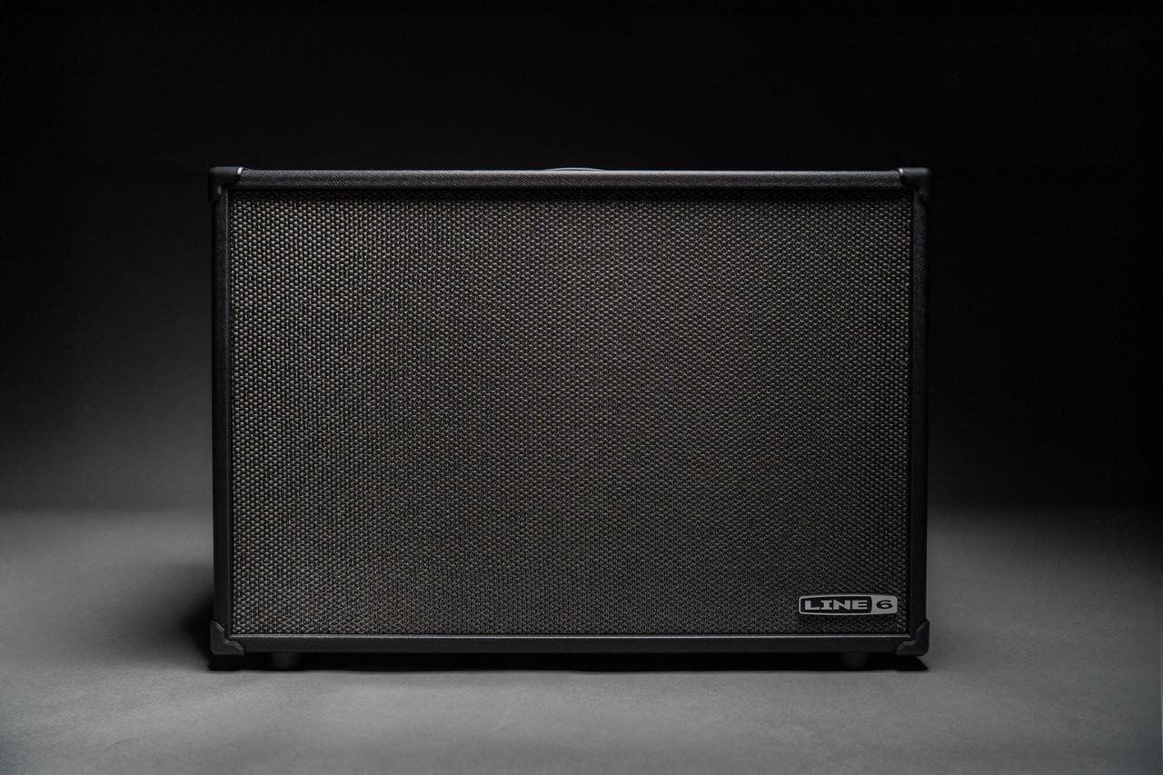 The Line 6 Powercab CL looks like the usual FRFR guitar speaker you might expect, but has switchable speaker voicings emulating classic drivers. It is pictured here onstage and in low-light situations.