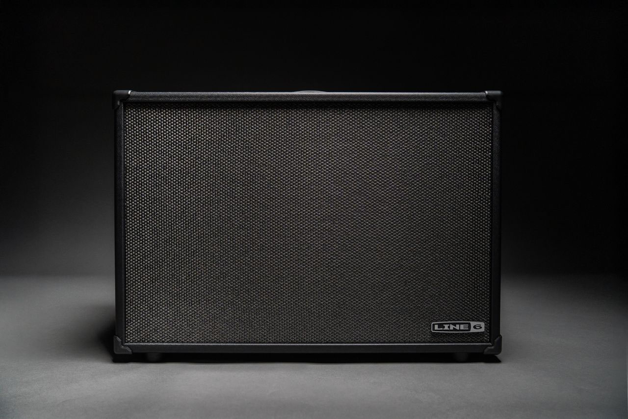 The Line 6 Powercab CL looks like the usual FRFR guitar speaker you might expect, but has switchable speaker voicings emulating classic drivers. It is pictured here onstage and in low-light situations.