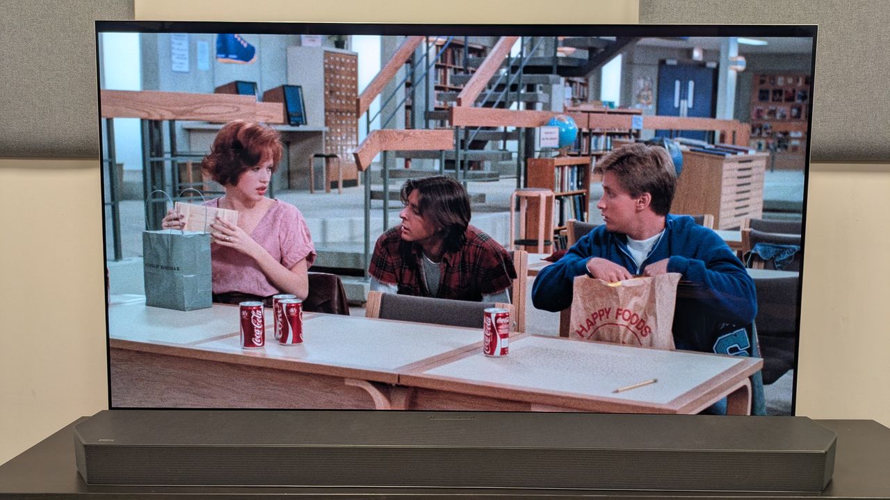 The Breakfast Club 4K Blu-ray on LG G5 OLED showing Claire, Andrew and Bender with coke cans and lunch