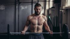 Man performing bicep curls with a barbell