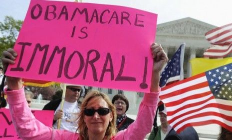 Opponents of President Obama&amp;#039;s health care legislation protest in March: Only 24 percent of Americans polled said the Supreme Court should uphold the entire law. 