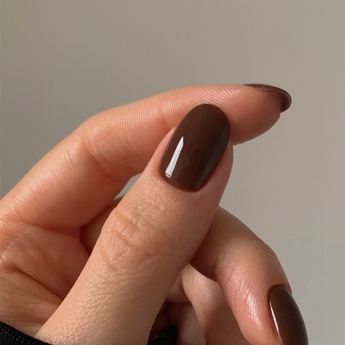 A chocolate brown manicure by Georgia Rae.