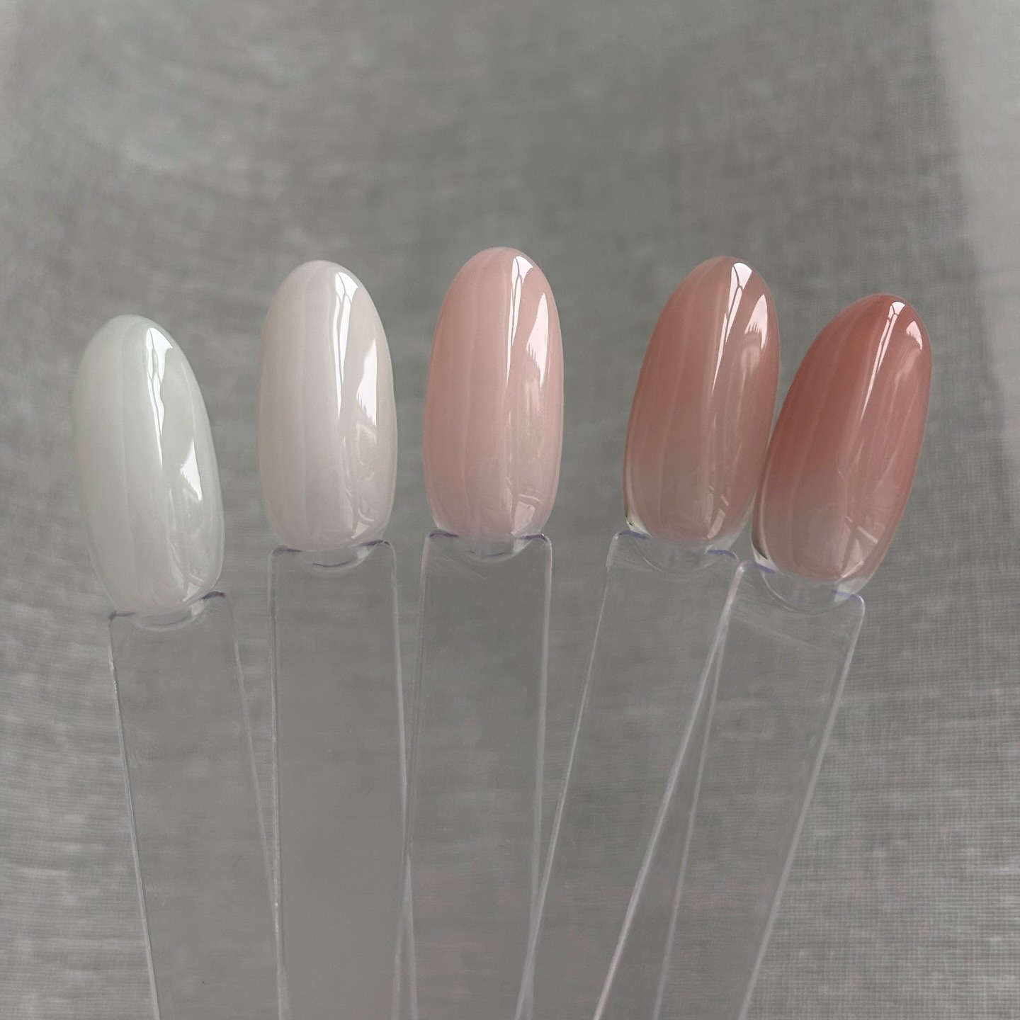 Swatches of the 5 Glass Gel and Glass Polish shades, from milky white, sheer pink, peachy pink, rose and neutral